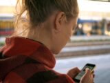 woman holding phone