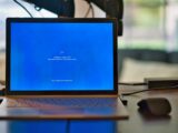 macbook pro on brown wooden table