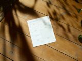 a piece of paper sitting on top of a wooden floor