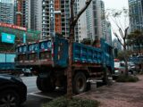 blue truck on road during daytime