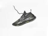 unpaired gray Nike running shoe
