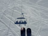 aerial photography of ski lift shadow on snow field during day