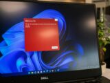 a dell laptop computer with a red screen
