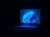a macbook air laptop in a dark room
