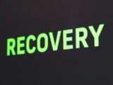 a close up of a sign that reads recovery