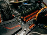 a close up of a computer motherboard with wires