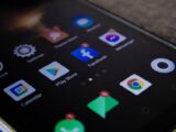 Detailed view of a smartphone screen with popular app icons including Facebook and Messenger.