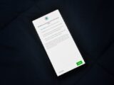 Close-up of smartphone screen showing a privacy policy update agreement.