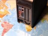 a desktop computer sitting on top of a map