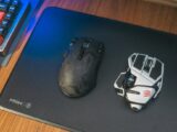 Close-up of two wireless gaming mice on a desk, showcasing modern technology.
