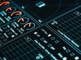 Close-up of a digital interface showcasing futuristic graphs and data analytics in low light.