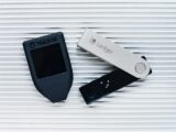 two electronic devices sitting next to each other