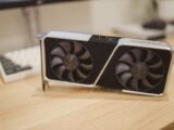 Close-up of a GeForce RTX graphics card on a desk, showcasing its design and technology.