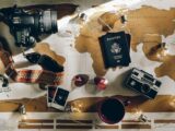 black DSLR camera near passport