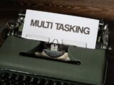 a close up of a typewriter with a paper on it