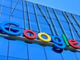 the google logo is displayed on the side of a building