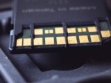 Detailed macro shot of SD card connector pins, highlighting technology and electronics.
