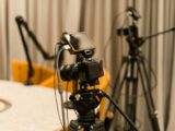 A professional studio with cameras, microphones, and other equipment ready for recording or live streaming.