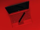 black pen on red laptop computer