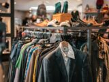 a rack of clothes and shoes in a store