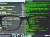 black framed eyeglasses on computer screen