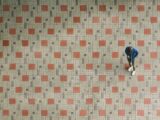 man standing on brown and beige ground