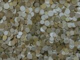 round silver-and-gold-colored coin collection