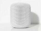 tubular white Bluetooth speaker on white surface
