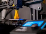 a close up of a machine with a blue light on it