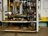 Detailed view of complex industrial machinery featuring metal components and wiring.