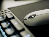 Elegant close-up shot of a modern mouse and keyboard, conveying technology and productivity.