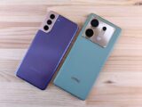 Two smartphones on a wooden surface, showcasing sleek design and modern technology.