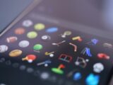 Sports icons are displayed on a phone's screen.