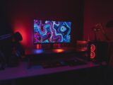 black flat screen computer monitor turned on near black computer keyboard