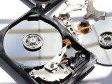 Detailed view of disassembled HDD showing intricate internal components.