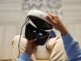 Close-up of hands holding a virtual reality headset, ready for immersive experience.