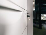 Close-up of a key in a locked office drawer for secure storage and privacy.