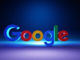 The Google logo in colorful 3D letters on a dark blue surface