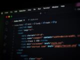 Close-up of HTML code displayed on a computer screen in dark mode, focusing on programming concepts.
